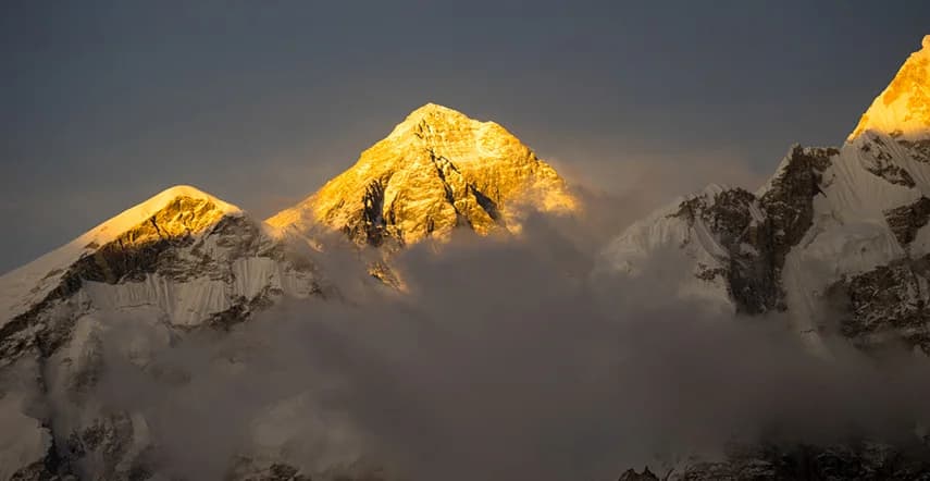 Golden mountain peak at sunrise