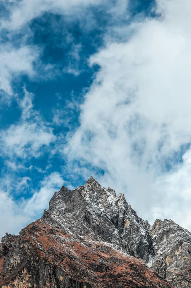 Snowy peak against blue sky