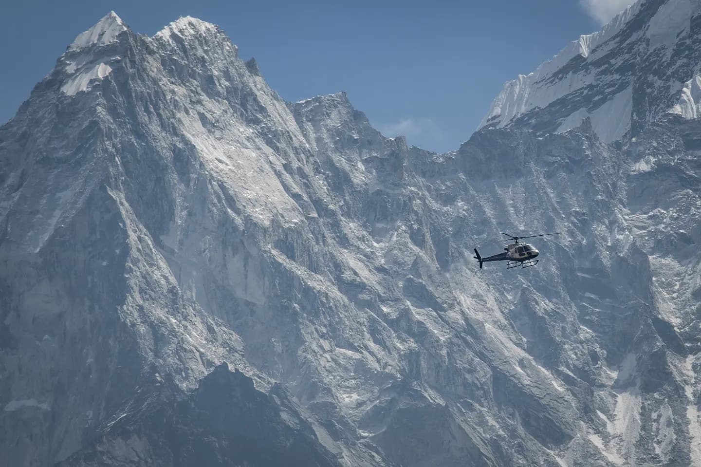 Mountain range with helicopter silhouette