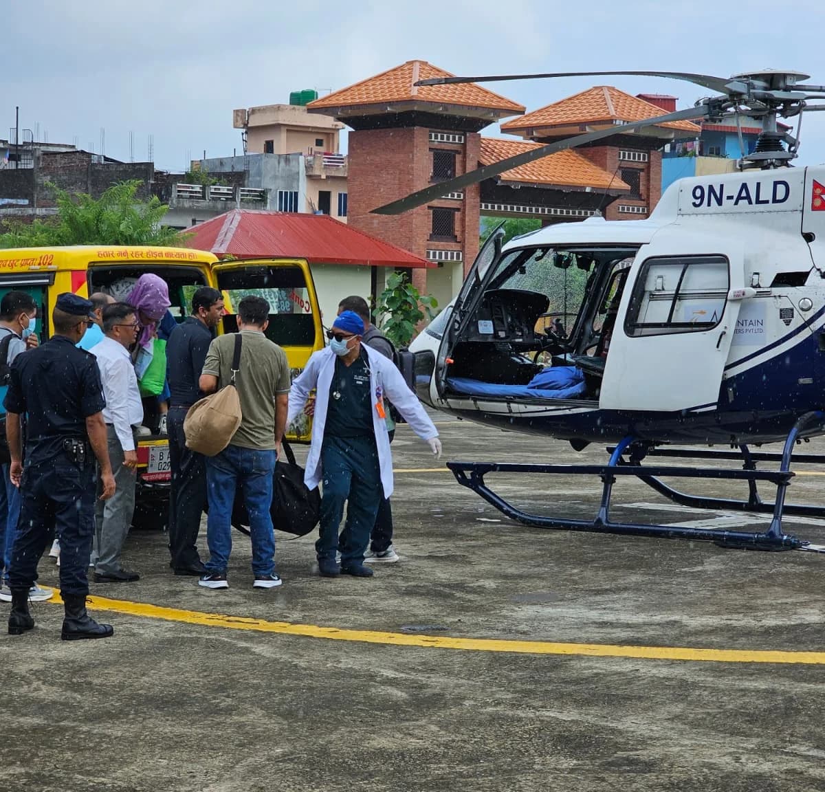 Paramedics transferring a patient during an emergency medical evacuation